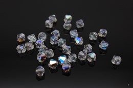 Биконусы хрустальные Preciosa 6 мм 10 шт Crystal Glitter (Чехия)